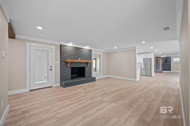 751 Abbey Way, Mobile, AL 36695 - unfurnished living room featuring a fireplace, crown molding, baseboards, light wood-style flooring, and recessed lighting