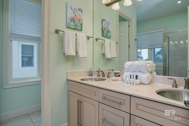 full bathroom featuring a sink, double vanity, tile patterned floors, and crown molding