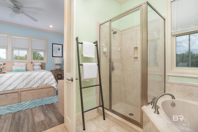 bathroom with a shower stall, crown molding, a garden tub, ensuite bathroom, and a ceiling fan
