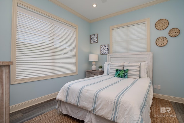 bedroom featuring recessed lighting, crown molding, baseboards, and wood finished floors