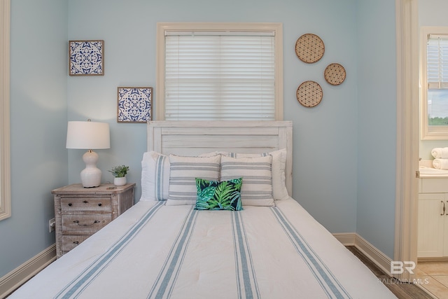 bedroom featuring baseboards