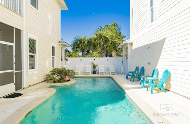 view of pool featuring fence, a patio area, and a fenced in pool