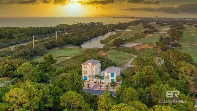 aerial view at dusk with a water view