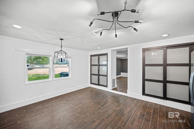 24663 Chestnut St Unit A & B, Elberta, AL 36530 - unfurnished room with a chandelier, dark wood-type flooring, baseboards, and recessed lighting