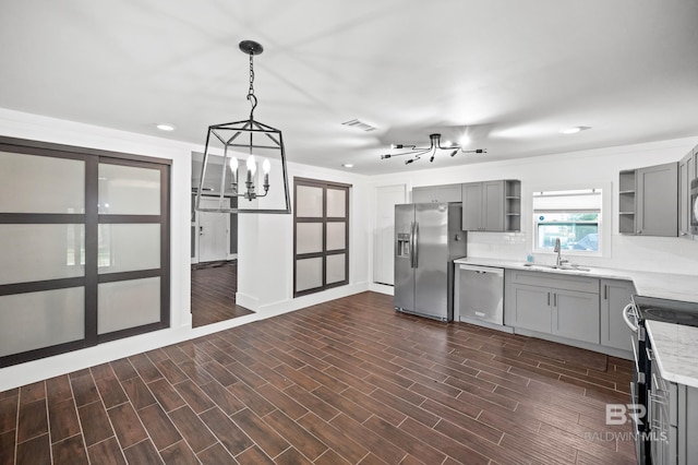 24663 Chestnut St Unit A & B, Elberta, AL 36530 - kitchen with appliances with stainless steel finishes, gray cabinetry, a chandelier, open shelves, and a sink