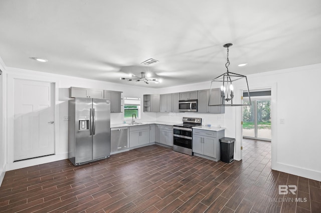 24663 Chestnut St Unit A & B, Elberta, AL 36530 - kitchen featuring appliances with stainless steel finishes, a chandelier, gray cabinetry, healthy amount of natural light, and recessed lighting