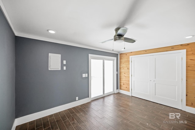 24663 Chestnut St Unit A & B, Elberta, AL 36530 - unfurnished bedroom featuring baseboards, dark wood-type flooring, recessed lighting, wood walls, and ceiling fan