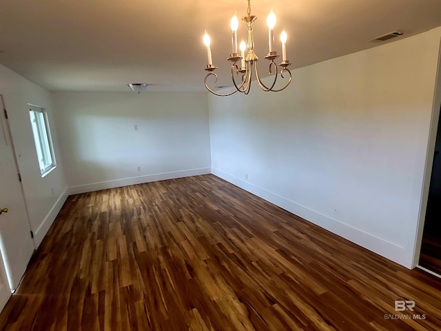 24663 Chestnut St Unit A & B, Elberta, AL 36530 - unfurnished dining area featuring dark wood finished floors, baseboards, and a chandelier