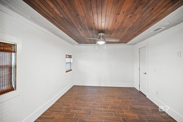 24663 Chestnut St Unit A & B, Elberta, AL 36530 - unfurnished room with dark wood-type flooring, brick wall, ceiling fan, wooden ceiling, and baseboards