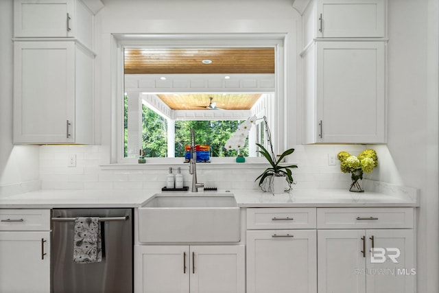 kitchen featuring a sink, a healthy amount of sunlight, white cabinetry, and dishwasher