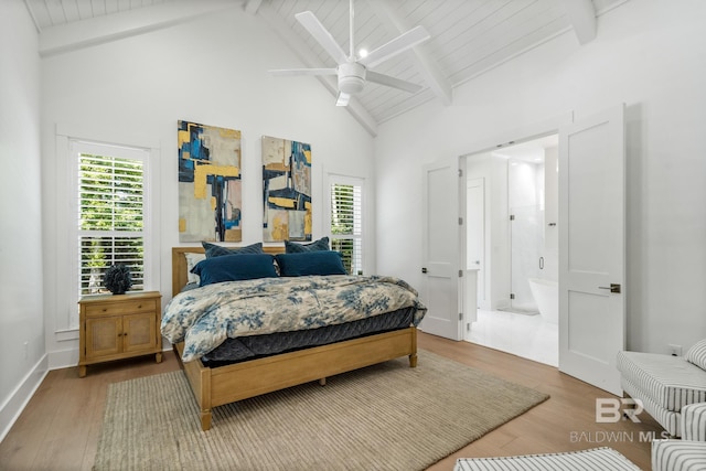 bedroom with ceiling fan, high vaulted ceiling, wood finished floors, baseboards, and beam ceiling