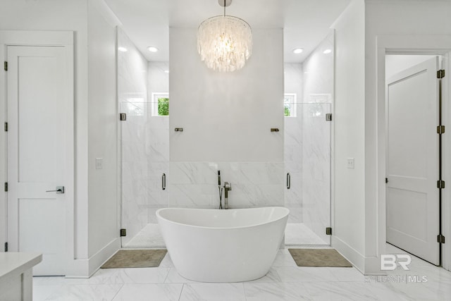 bathroom featuring a freestanding bath, marble finish floor, a stall shower, and recessed lighting