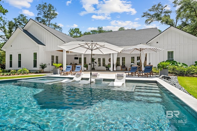 outdoor pool featuring french doors, a patio area, a jacuzzi, and an outdoor hangout area