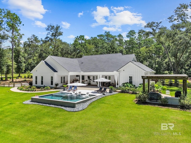 rear view of house featuring a pergola, a yard, an outdoor pool, board and batten siding, and a patio area