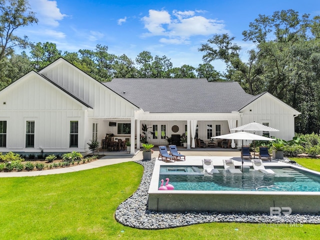 back of house with an outdoor pool, a lawn, a patio, french doors, and board and batten siding