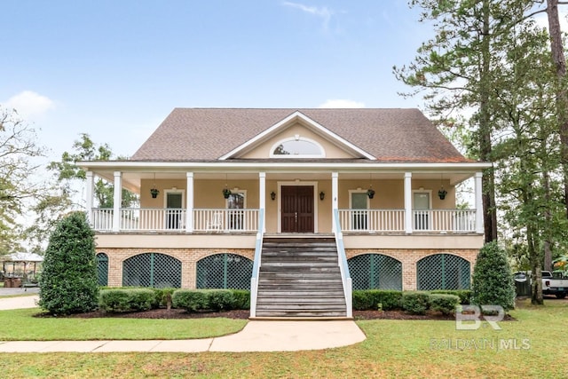 view of front of house with a front lawn and covered porch