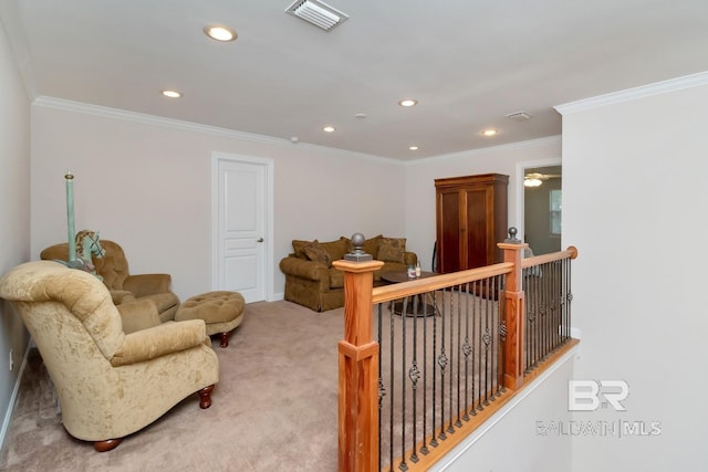 living area with crown molding and carpet floors