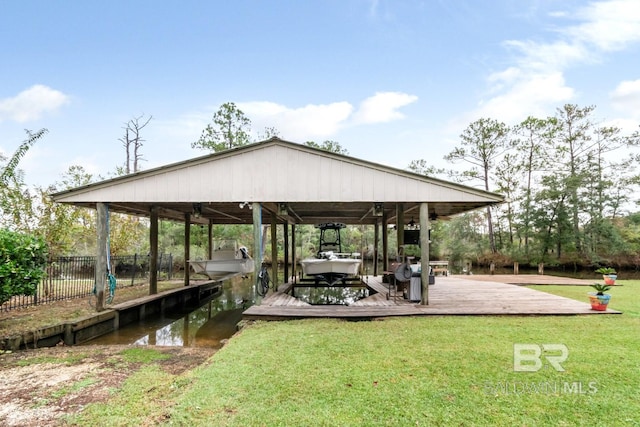 view of dock with a water view and a yard