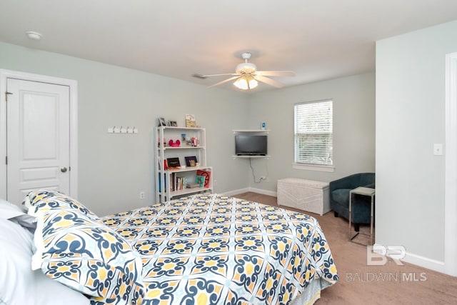 carpeted bedroom featuring ceiling fan