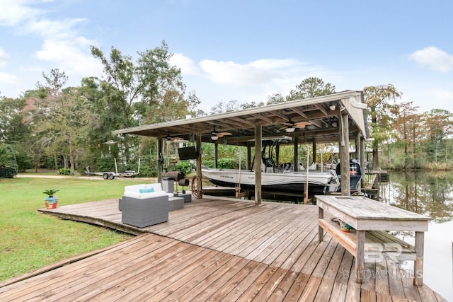 view of dock featuring a water view and a lawn