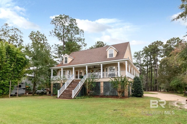 cape cod-style house with covered porch and a front lawn