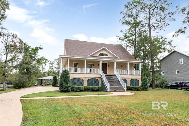 view of front facade featuring a front lawn and covered porch