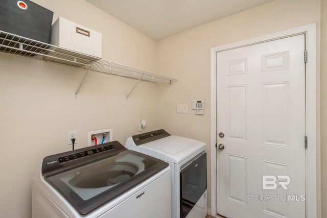 washroom with washer and clothes dryer