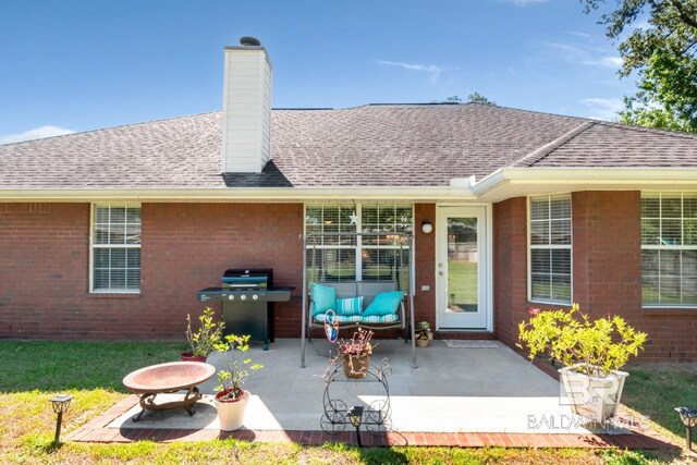 rear view of house with a patio