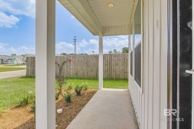 view of patio / terrace featuring fence