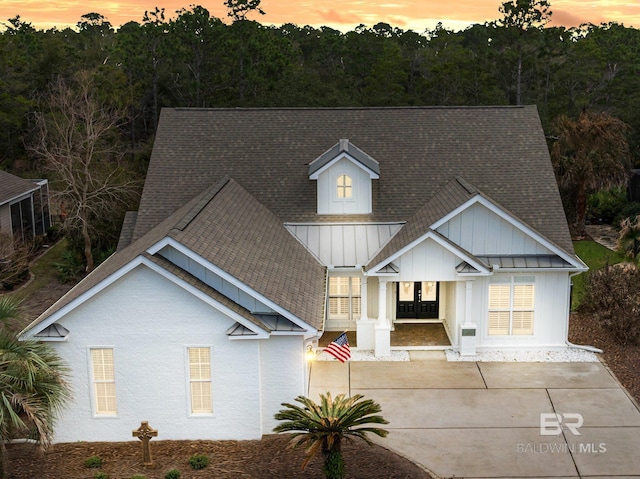 524 Retreat Ln, Gulf Shores, AL 36542 - view of front of property with board and batten siding and roof with shingles