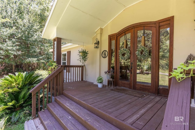 entrance to property featuring french doors and a deck