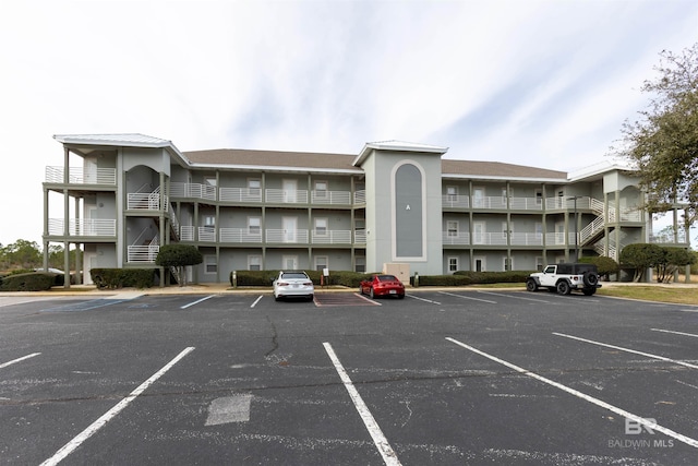 view of property with uncovered parking