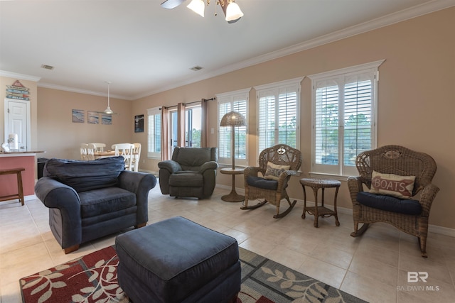 living room with crown molding, light tile patterned flooring, and a healthy amount of sunlight