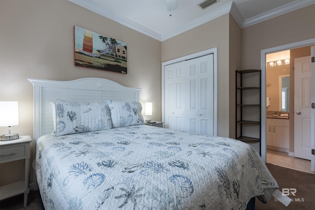 bedroom featuring visible vents, a closet, ornamental molding, and ensuite bathroom