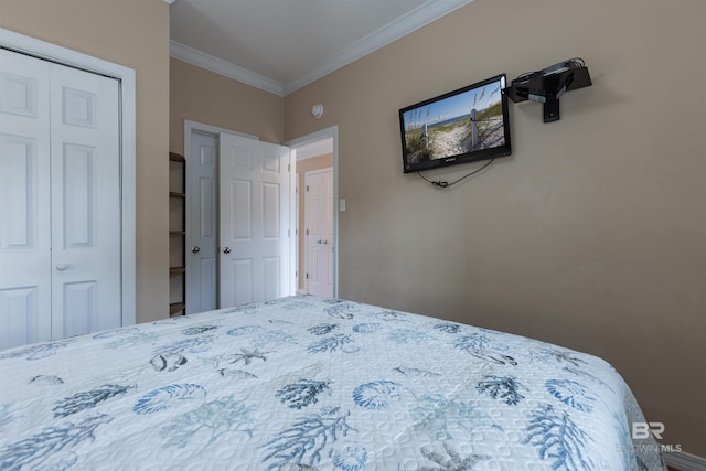 bedroom with a closet and crown molding