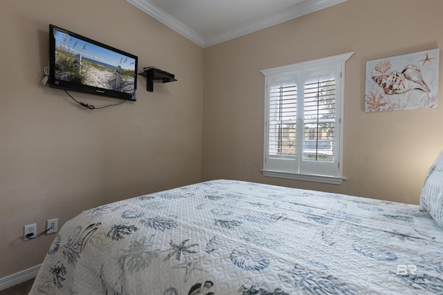 bedroom with baseboards and ornamental molding