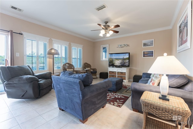 living room featuring light tile patterned floors, visible vents, crown molding, and a ceiling fan