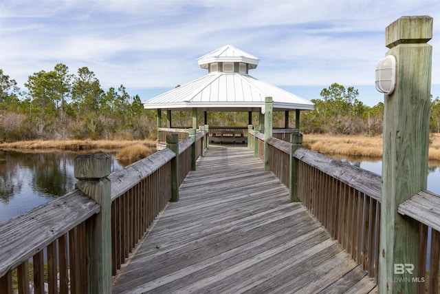 dock area with a gazebo and a water view