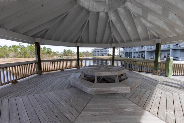 deck with a gazebo and a water view