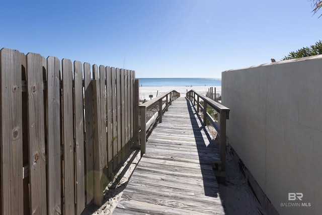 view of community with a view of the beach and a water view