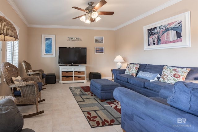 living area featuring baseboards, a ceiling fan, and ornamental molding