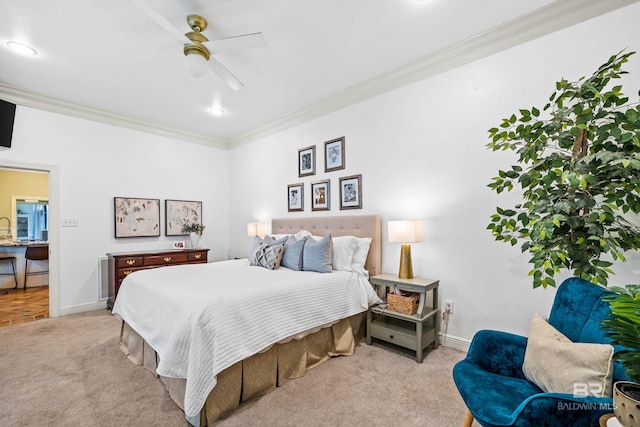 carpeted bedroom featuring ceiling fan and crown molding