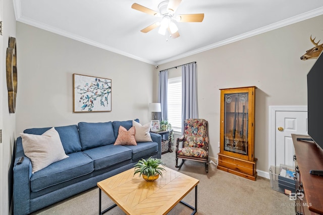 living room featuring ceiling fan, crown molding, and carpet