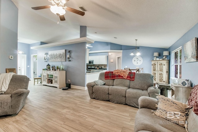 10675 Aloe Ln, Lillian, AL 36549 - living room with lofted ceiling, light wood-type flooring, and ceiling fan