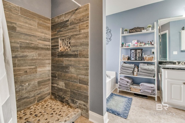 10675 Aloe Ln, Lillian, AL 36549 - full bath with a tile shower, a garden tub, vanity, and tile patterned flooring