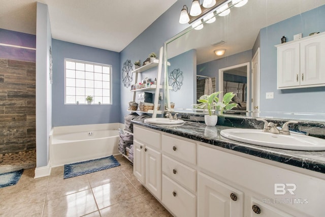 10675 Aloe Ln, Lillian, AL 36549 - full bath with a shower stall, double vanity, a bath, and tile patterned flooring