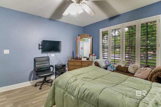 10675 Aloe Ln, Lillian, AL 36549 - bedroom featuring light wood-style flooring, baseboards, and ceiling fan