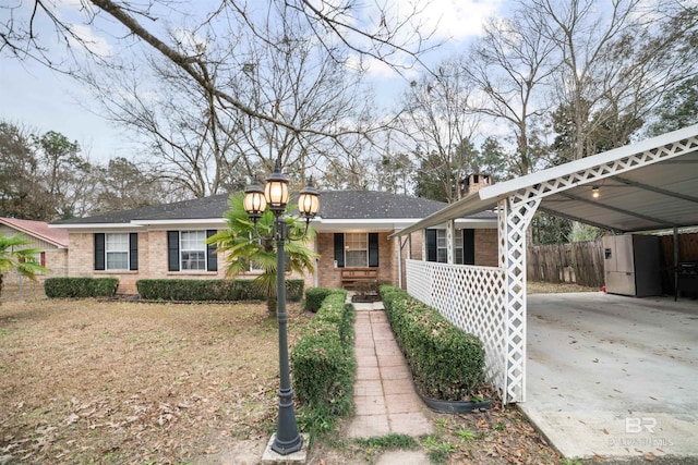 ranch-style home with a carport