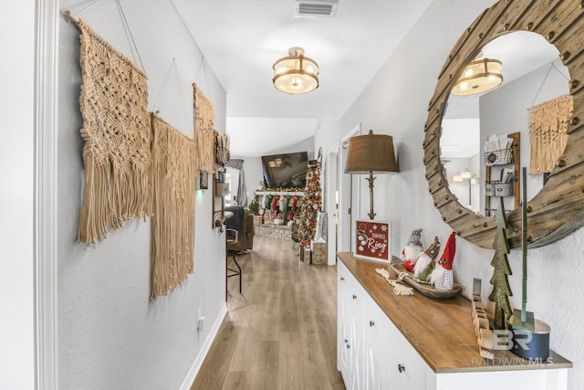 hallway featuring light wood-type flooring