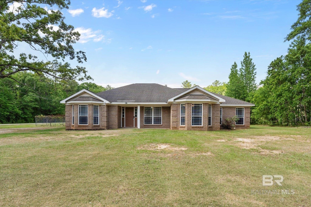 310 W 10th St, Bay Minette, AL 36507 - single story home with brick siding and a front lawn